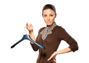Woman holding a clothes hanger